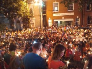 gathering of large group of people at night