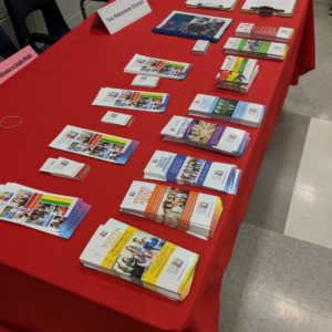Frederick Center pamphlets lined up on red table cloth