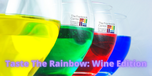 rainbow colored wine in wine glasses