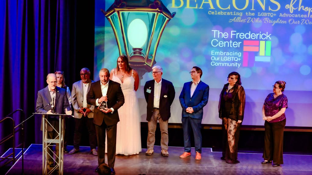 Award recipients on stage at the Beacons of Hope Prism Awards Gala