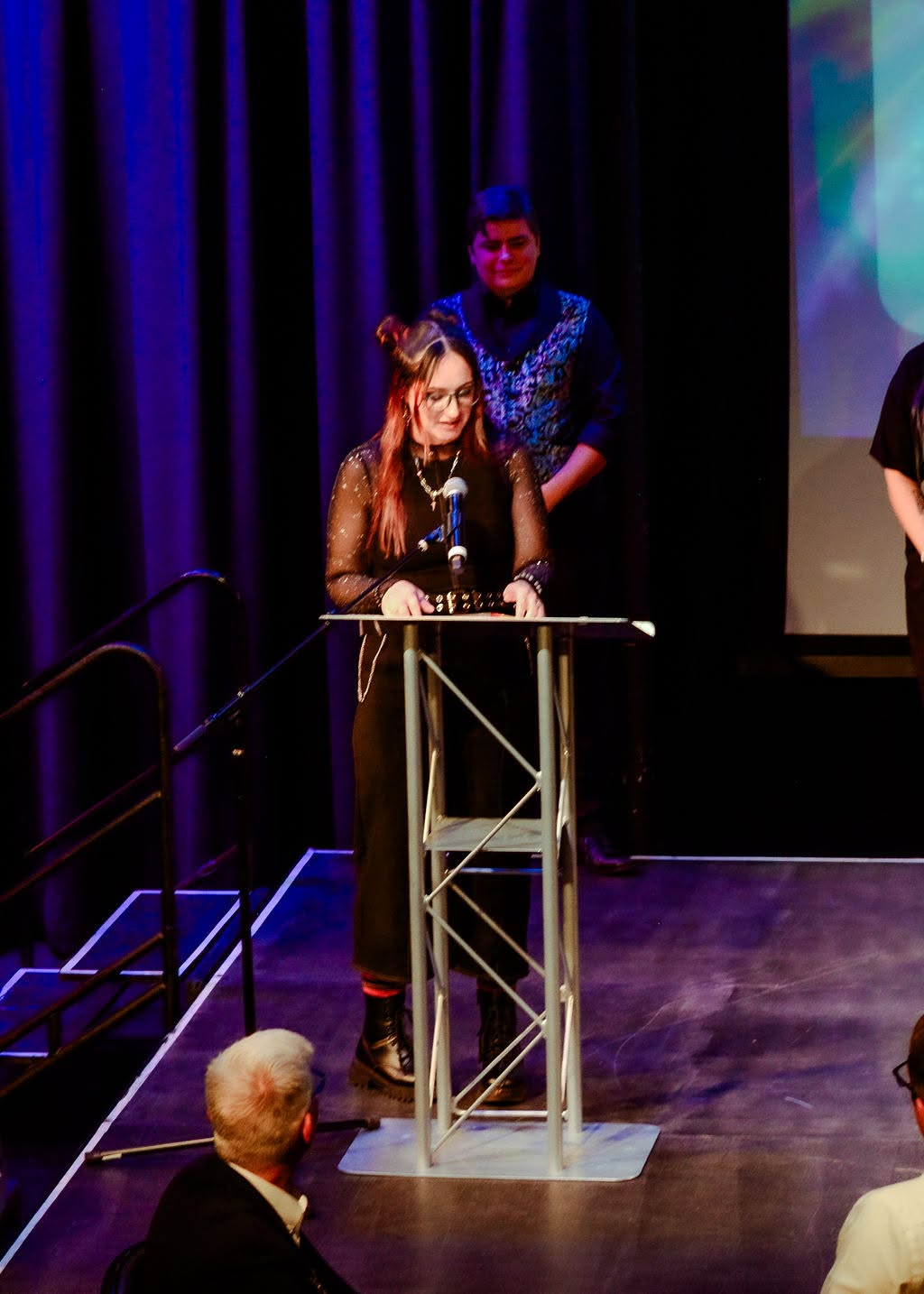 A speaker at the podium during the Prism Awards Gala